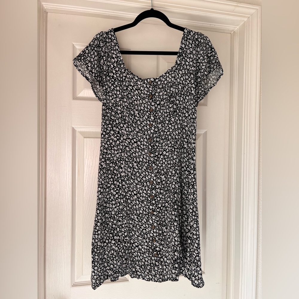 Women’s black dress with white flowers